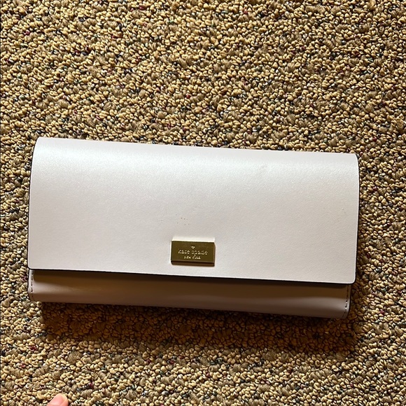 kate spade Handbags - Kate Spade Cream Clutch with Gold Detail